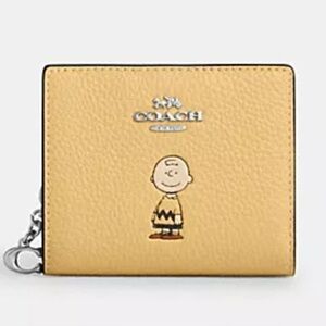 NWT Coach x Peanuts Snap Wallet featuring Charlie Brown